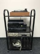 A trolley containing a quantity of audio equipment to include amplifier,