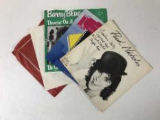 Four boxes containing a large quantity of 45's, rock including David Bowie,