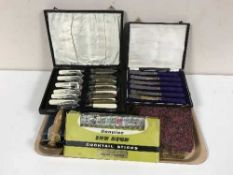 A tray of assorted boxed plated cutlery, boxed Genuine Insign cocktail sticks,