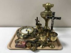 A tray containing ships porthole wall clock, crucifixes, goblets,
