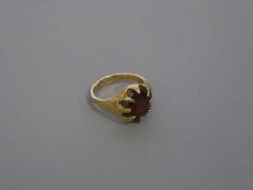 A 9ct gold garnet set ring, size M, 6.1g.