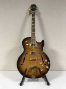 A Gould electric guitar on stand