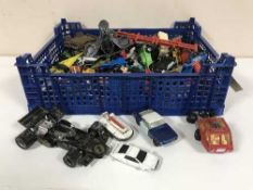 Two baskets of play worn die cast vehicles, children's annual and books .