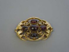 Large and impressive Victorian gold brooch set with cabochon garnets