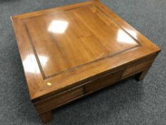 A contemporary hardwood coffee table