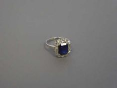 An 18ct white gold sapphire and diamond cluster ring