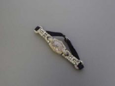 Superb quality Lady's platinum cocktail watch set with approximately 2.