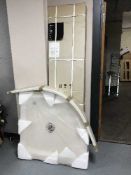 A boxed shower quadrant with shower tray