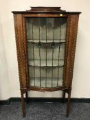 A Victorian inlaid mahogany display cabinet