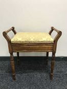 A mahogany piano stool