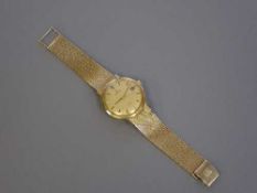 A Gent's 9ct gold Omega Automatic Calendar Centre Seconds Wristwatch, model: De Ville,