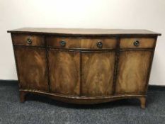 A Regency style four door bow-fronted sideboard