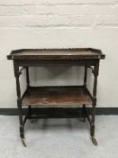 A mahogany two tier TOT trolley