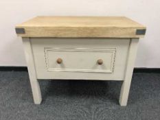 A painted pine butcher's block fitted with a drawer
