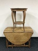 An oak gate leg table and an occasional table