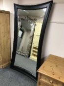 A contemporary wavy edged mirror,