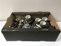 A box containing assorted Denby dinner ware