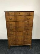 A walnut mid 20th century seven drawer chest