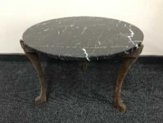 A marble topped coffee table on oak base