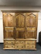A contemporary oak 'flag stone' triple door wardrobe with six drawers