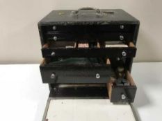 An early 20th century medical chest fitted with twelve drawers