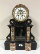 A Victorian two tone French marble mantle clock with open escapement and mercury pendulum