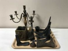 A tray containing metal five-way candelabra, small brass embossed pot,