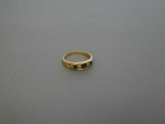 An 18ct gold ruby and diamond ring, size N, 3.