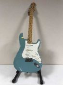 A Tanglewood electric guitar on stand