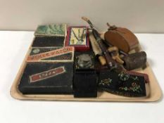 A tray of wooden pipes, leather cased brush, hair clippers, rolls razor, desk stand,