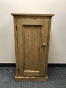 A pine single door cabinet