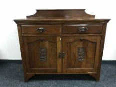 An Edwardian mahogany sideboard
