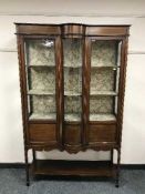 An Edwardian inlaid mahogany glazed display cabinet