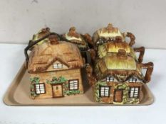 Six cottage ware teapots,