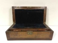 A walnut and mahogany writing box with brass inlay