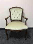 A continental style armchair in green dralon