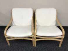 A pair of bamboo conservatory armchairs