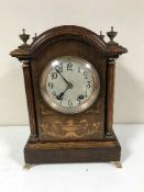 An Edwardian inlaid mahogany quarter-striking eight-day bracket clock,