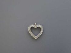 A white gold diamond set heart pendant, 3.