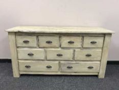 A painted pine nine drawer chest