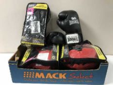 A box of boxing gloves and head guards