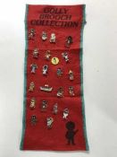 A collection of twenty-two Golly brooches