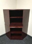 A pair of high gloss corner TV stands