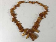 An amber necklace with 9ct gold clasp