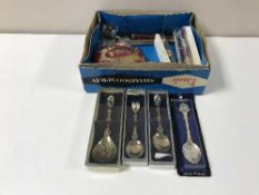 A box of crested tea spoons, BSA motor bike plaque, pens,