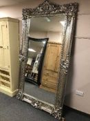 A very large silvered overmantel mirror,