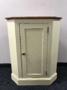 A painted pine corner cabinet