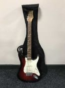 A Stagg Stratocaster electric guitar (copy) in carry bag