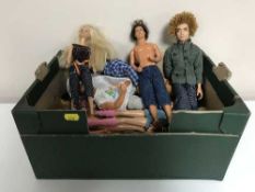 A boxed Barbie play set and a box of Barbie and Ken dolls