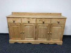 A pine four door sideboard